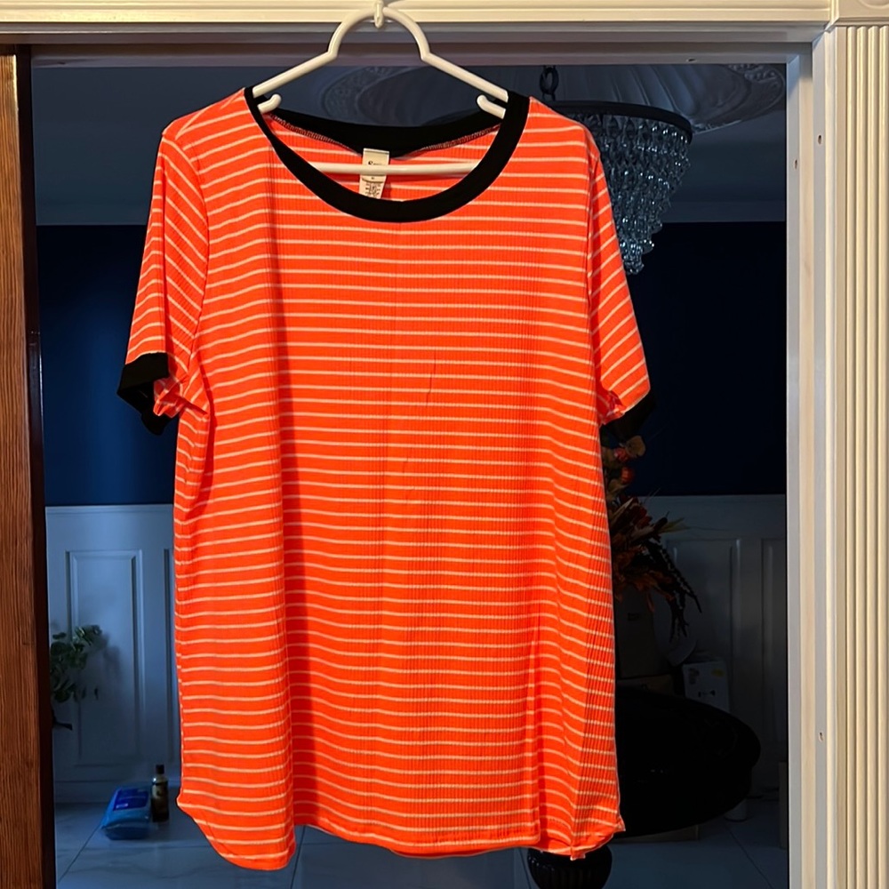 See in love orange with white horizontal stripes and black trim around neck